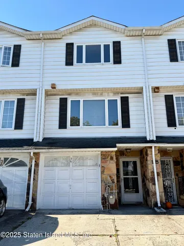 a kitchen with stainless steel appliances granite countertop a refrigerator and a stove