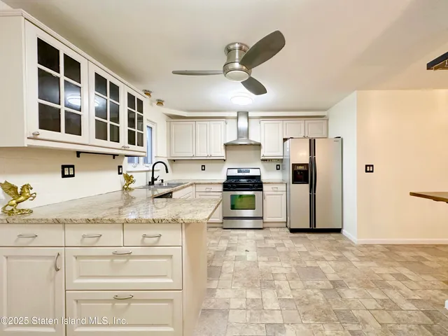 a view of a kitchen with a sink