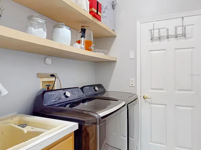 a utility room with dryer and washer