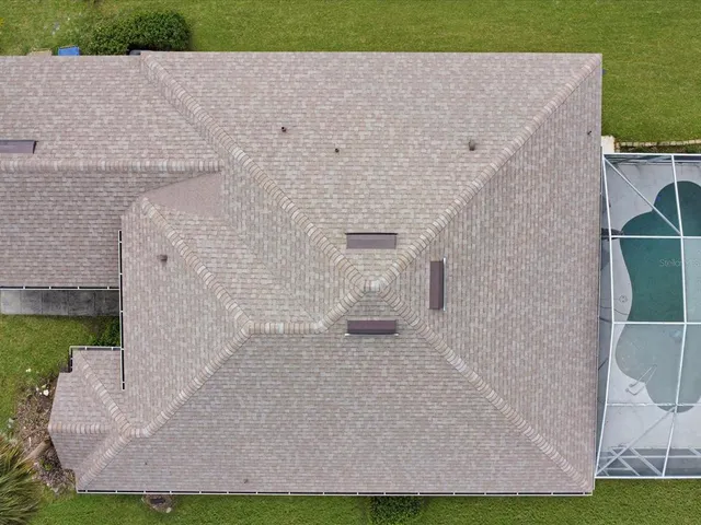 a aerial view of a house with a yard