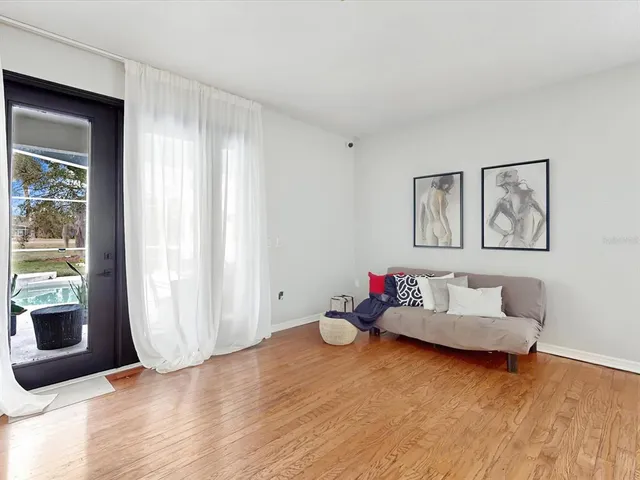 a living room with furniture and a window