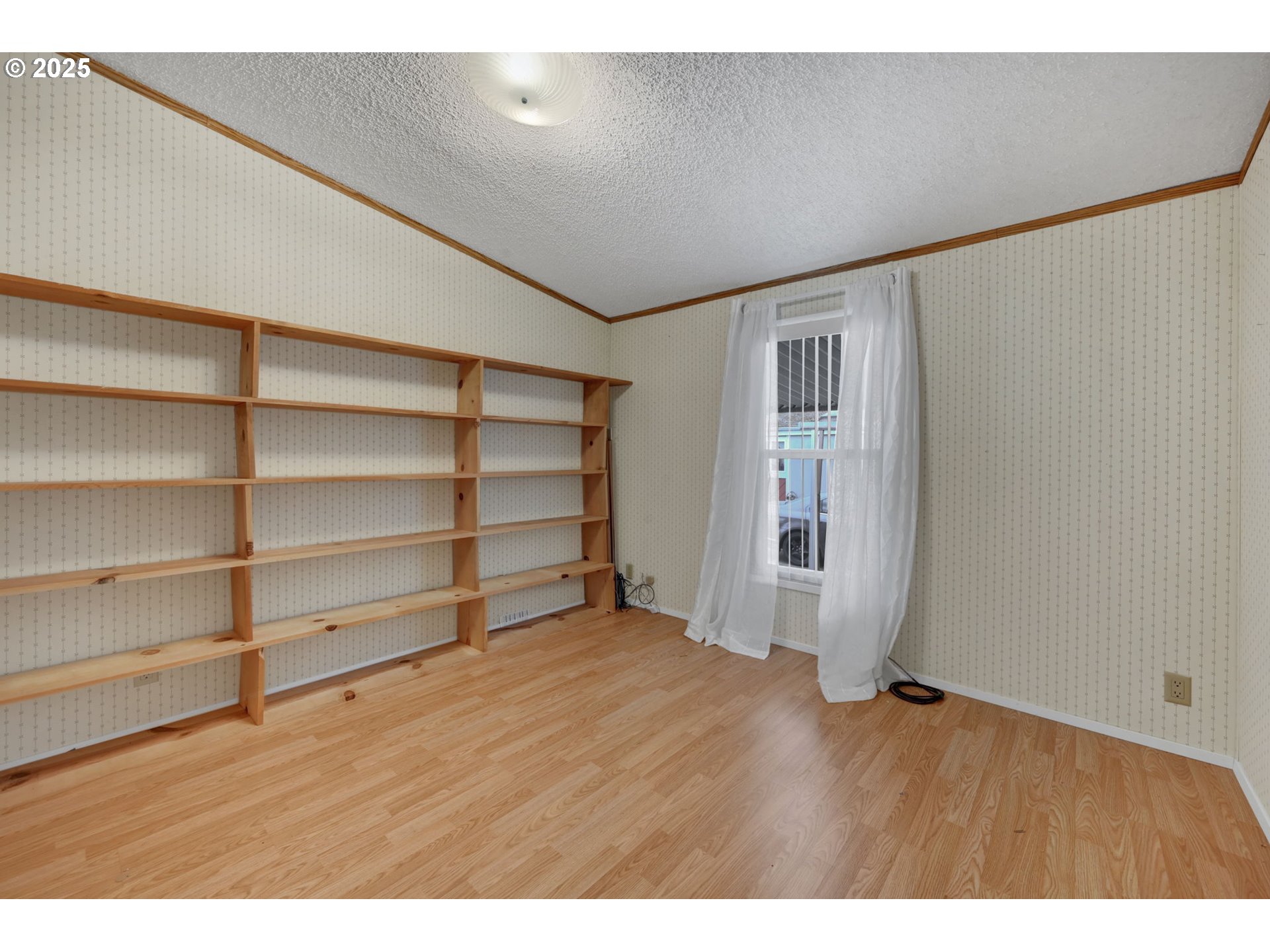 1120 West Fairview Drive, Unit 3 Springfield, OR 97477 - Photo 13 of 21 a view of an empty room with a closet