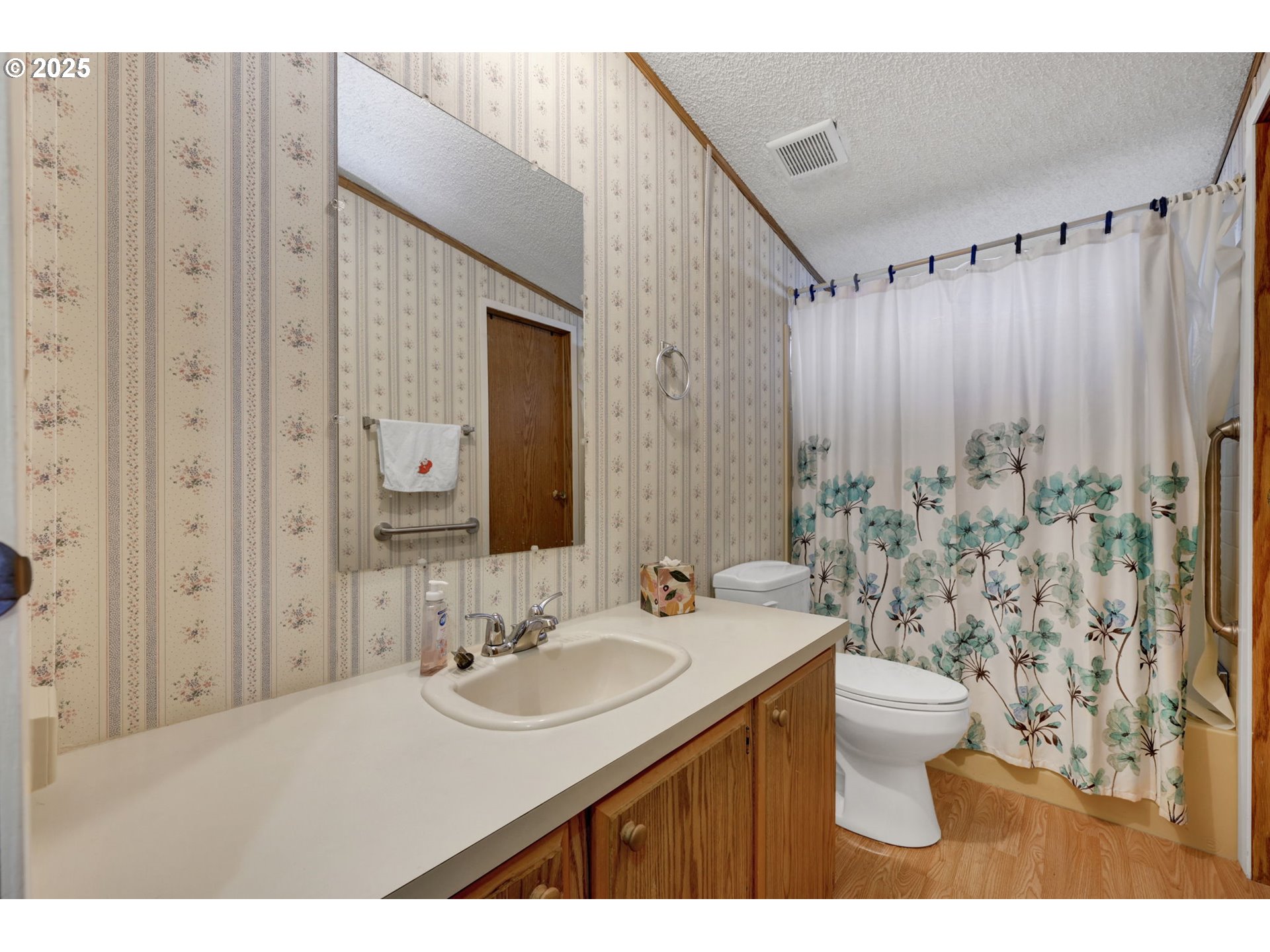 1120 West Fairview Drive, Unit 3 Springfield, OR 97477 - Photo 17 of 21 a bathroom with a sink and a mirror