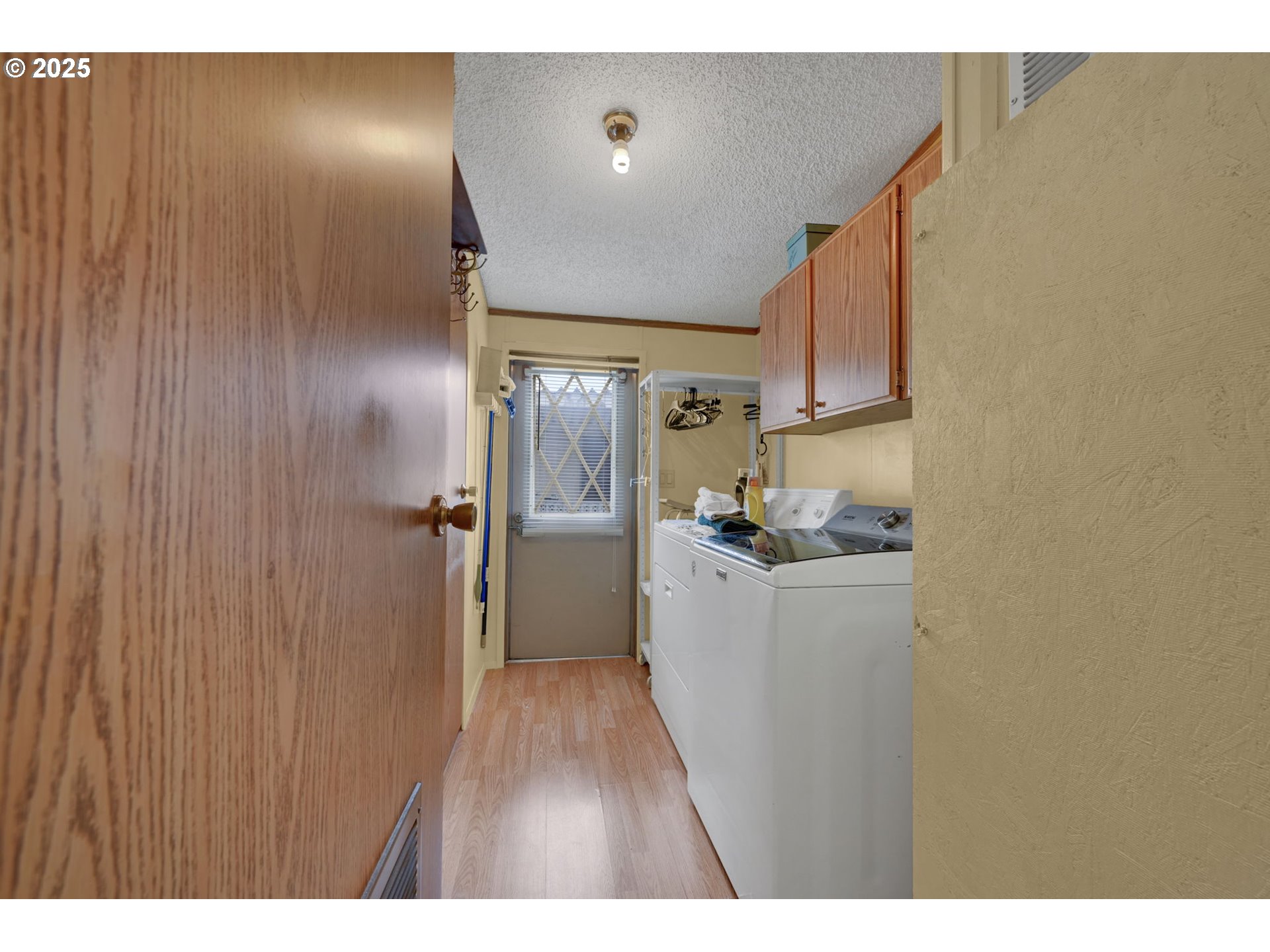 1120 West Fairview Drive, Unit 3 Springfield, OR 97477 - Photo 18 of 21 a kitchen with a refrigerator and a wooden floor