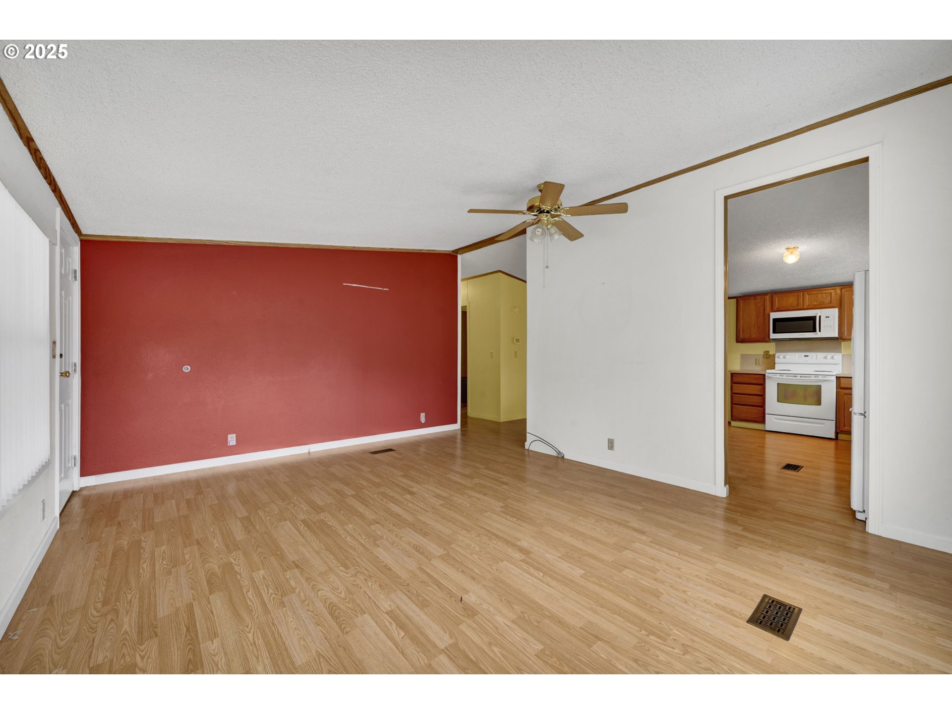 1120 West Fairview Drive, Unit 3 Springfield, OR 97477 - Photo 5 of 21 a view of an empty room with wooden floor