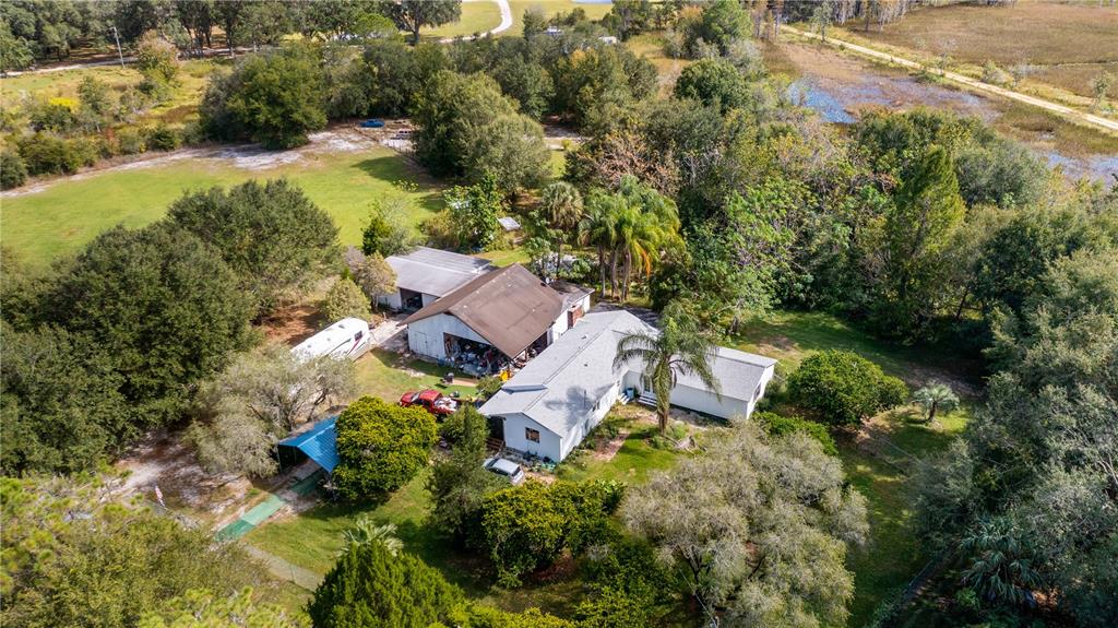2610 Stephens Road Groveland, FL 34736 - Photo 1 of 1 an aerial view of house with yard swimming pool and outdoor seating