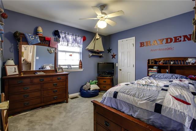 3479 Beckwith Road Mount Juliet, TN 37122 - Photo 13 of 20 a bedroom with a bed dresser and a window