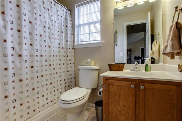 3479 Beckwith Road Mount Juliet, TN 37122 - Photo 15 of 20 a bathroom with a granite countertop sink a toilet and a mirror