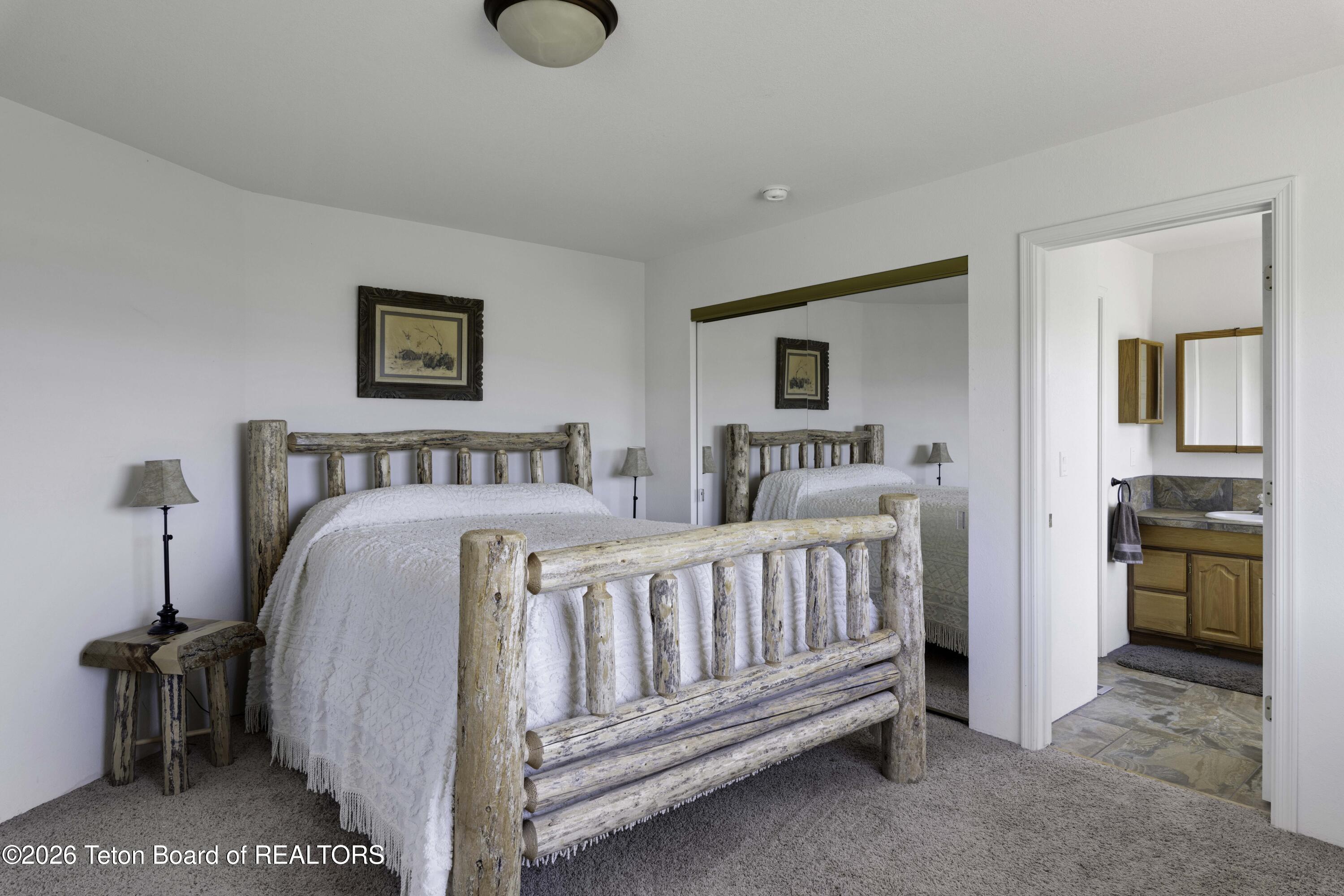 7585 South Squaw Creek Road Jackson, WY 83001 - Photo 10 of 26 Primary Bedroom