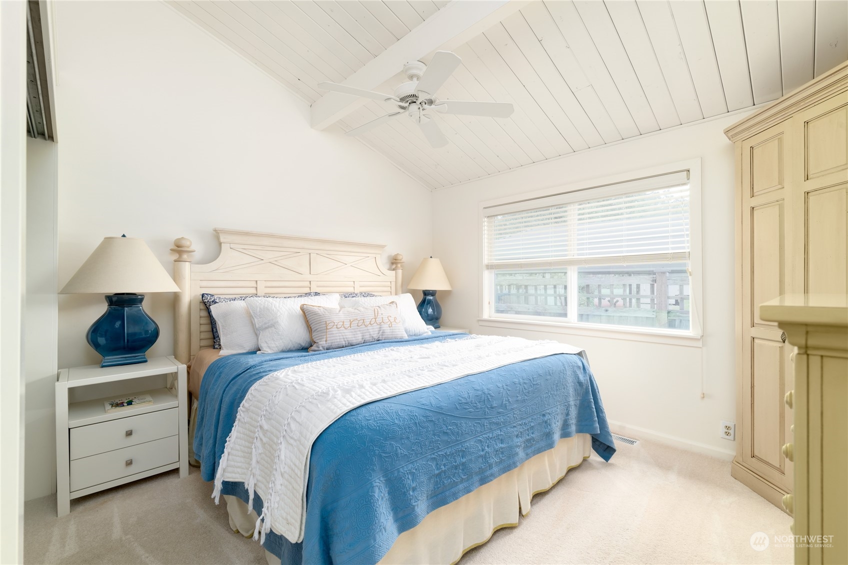 7681 Northeast North Shore Road Belfair, WA 98528 - Photo 11 of 40 a bedroom with a large bed and a window