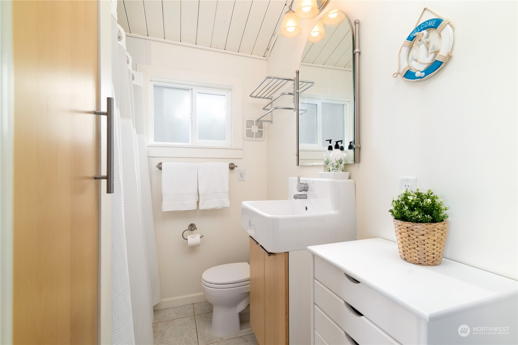 7681 Northeast North Shore Road Belfair, WA 98528 - Photo 12 of 40 a bathroom with a sink a toilet and shower