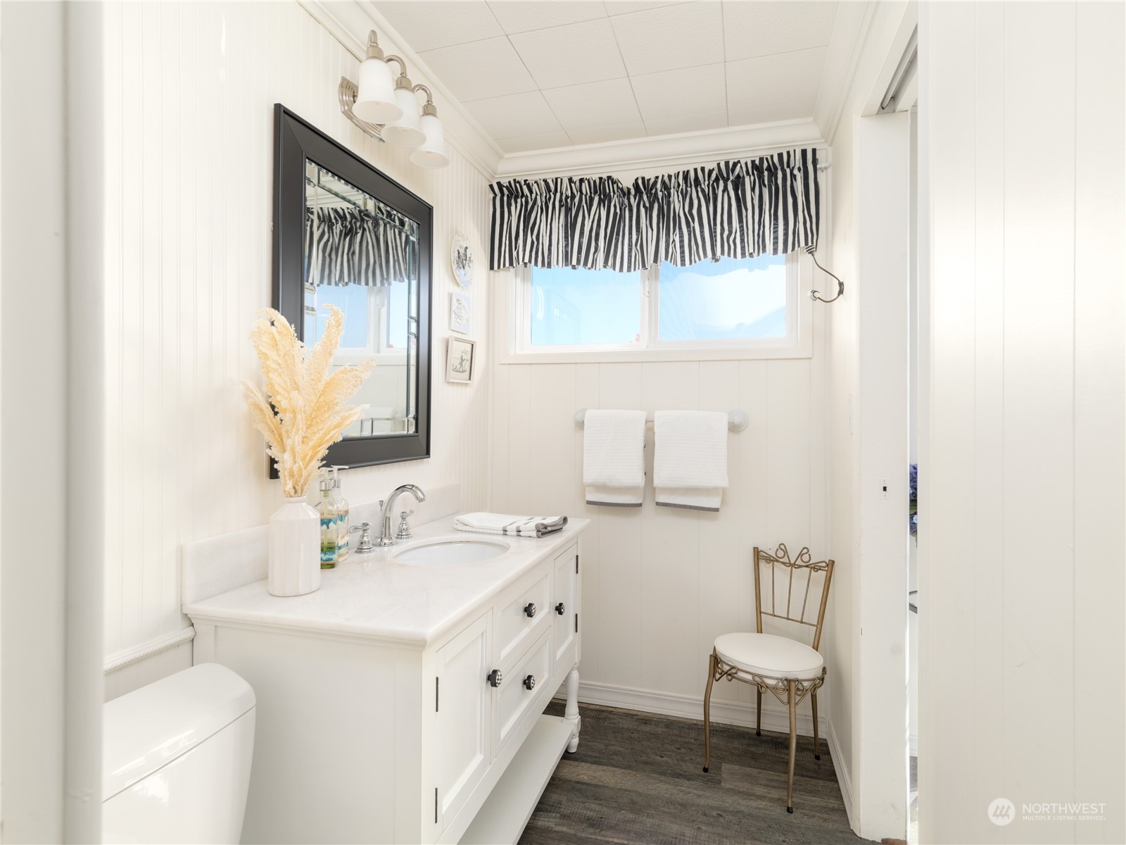 7681 Northeast North Shore Road Belfair, WA 98528 - Photo 20 of 40 a bathroom with a sink a toilet and a mirror