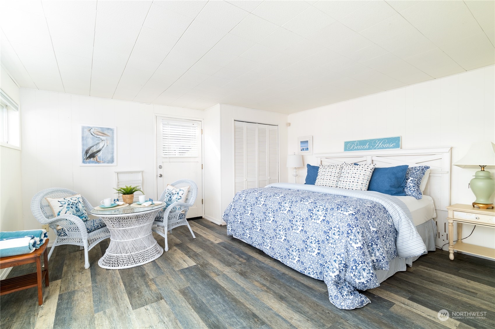 7681 Northeast North Shore Road Belfair, WA 98528 - Photo 22 of 40 a bedroom with a bed and a table