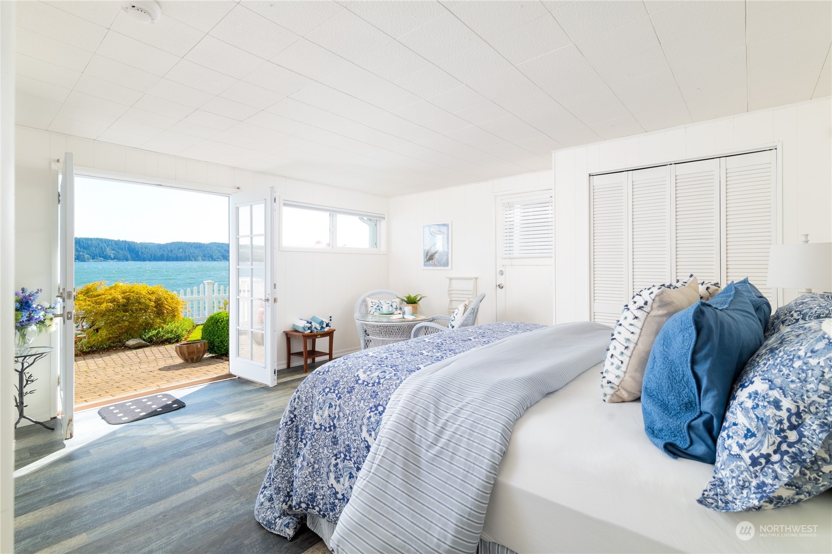 7681 Northeast North Shore Road Belfair, WA 98528 - Photo 23 of 40 a bed sitting in a spacious bedroom next to a window