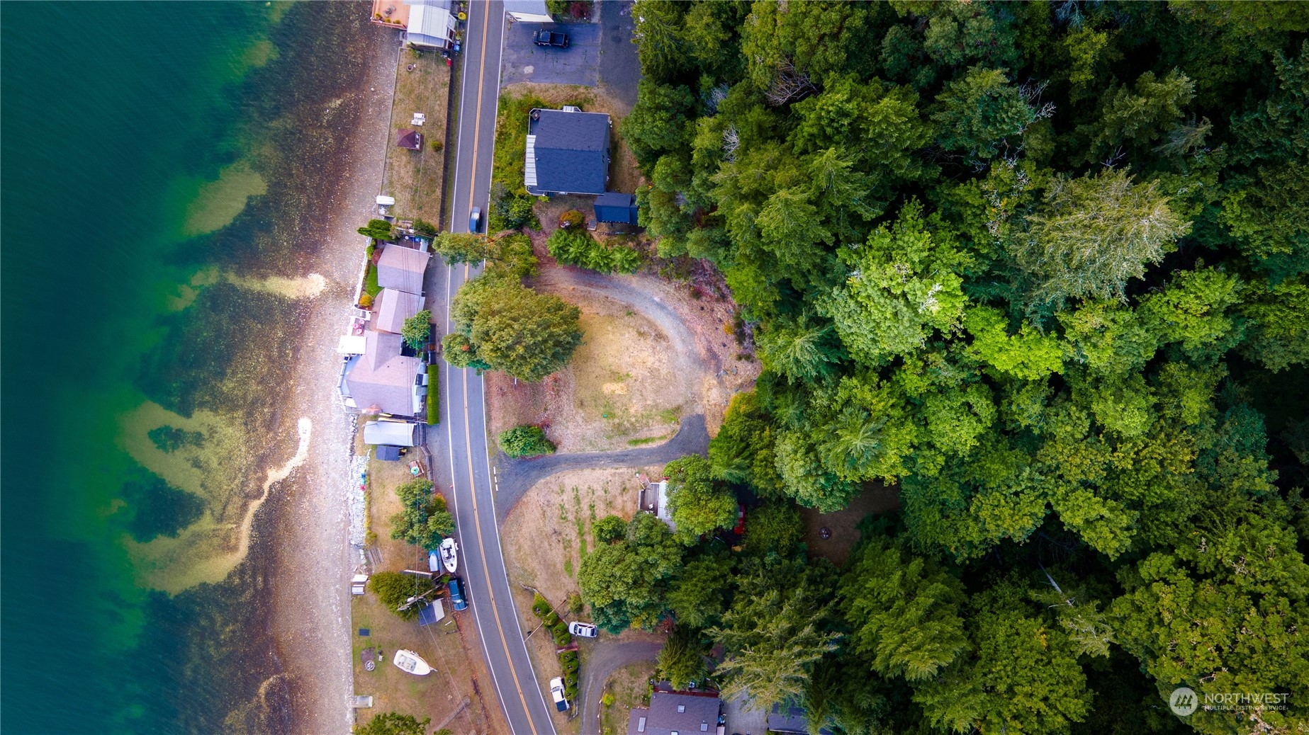 7681 Northeast North Shore Road Belfair, WA 98528 - Photo 39 of 40 an aerial view of residential houses with outdoor space