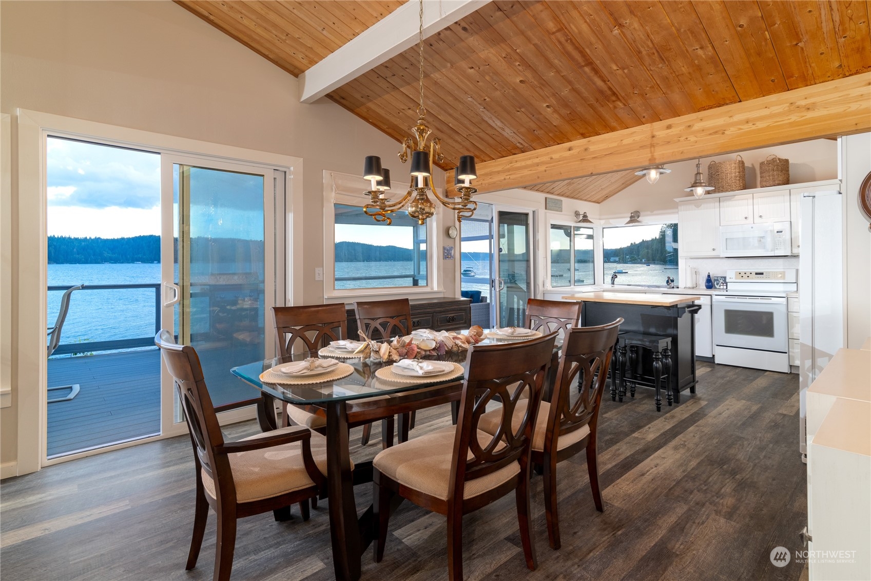7681 Northeast North Shore Road Belfair, WA 98528 - Photo 7 of 40 a view of a dining room with furniture and wooden floor