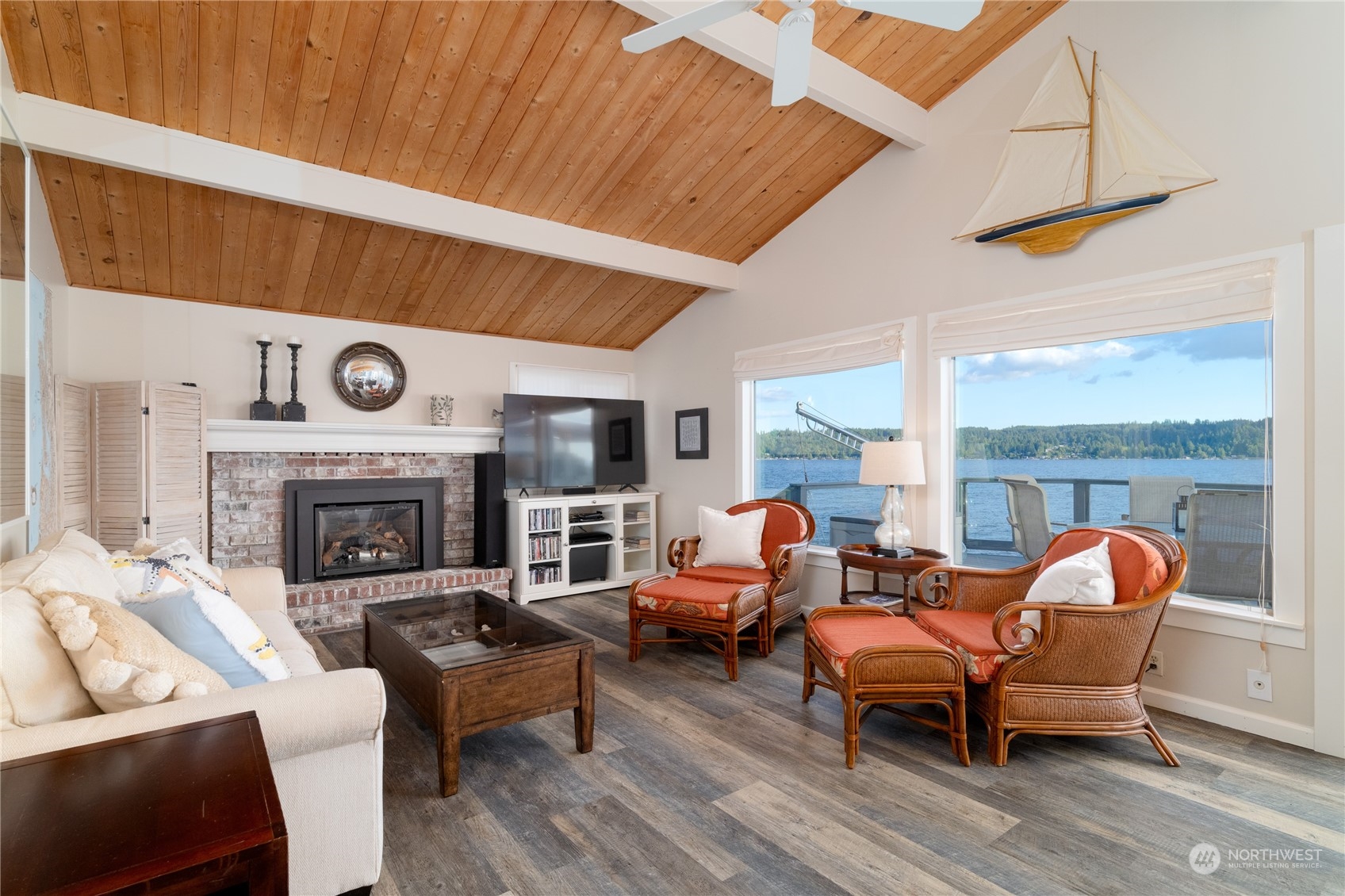 7681 Northeast North Shore Road Belfair, WA 98528 - Photo 8 of 40 a living room with furniture a fireplace and window