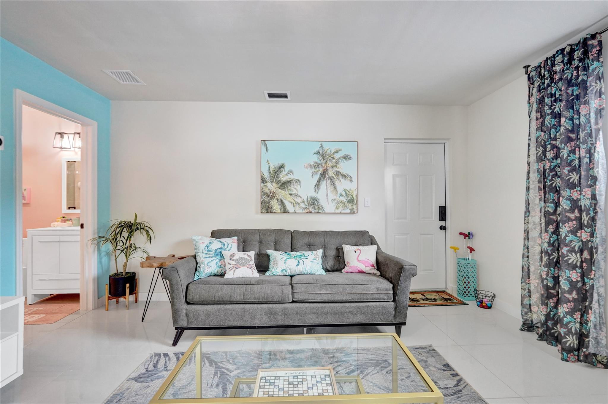 8236 Northwest 1st Place, Unit 2 Miami, FL 33150 - Photo 16 of 22 a bedroom with a bed and a painting on the wall