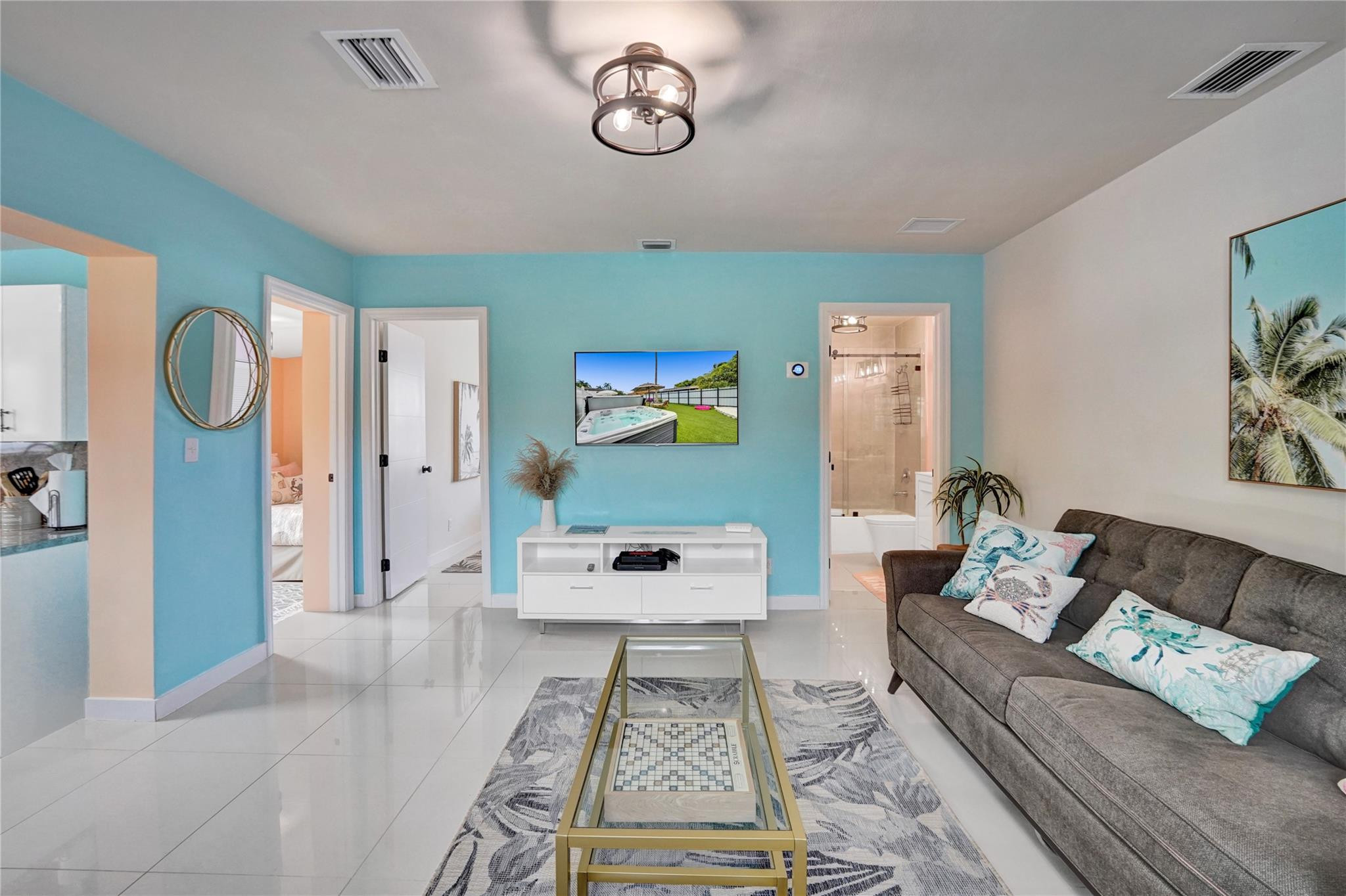 8236 Northwest 1st Place, Unit 2 Miami, FL 33150 - Photo 5 of 22 a living room with furniture and wooden floor