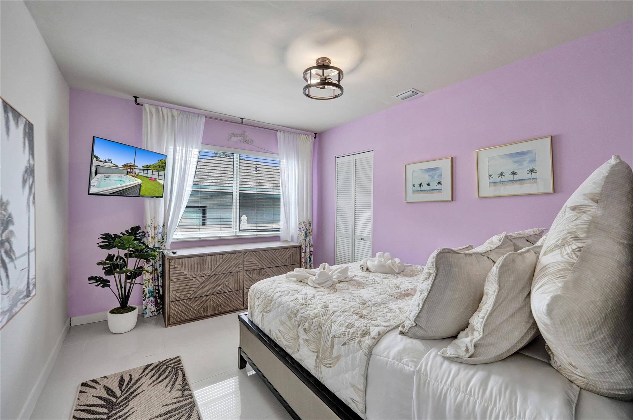 8236 Northwest 1st Place, Unit 2 Miami, FL 33150 - Photo 6 of 22 a bedroom with a bed and a couch