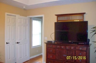 216 Foxrun Springfield, TN 37172 - Photo 13 of 21 a view of a bedroom with wooden floor windows and a fireplace