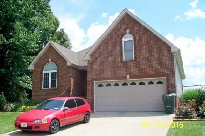 216 Foxrun Springfield, TN 37172 - Photo 3 of 21 a front view of a house with a yard