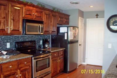 216 Foxrun Springfield, TN 37172 - Photo 9 of 21 a kitchen with stainless steel appliances granite countertop a stove top oven a refrigerator and a cabinets