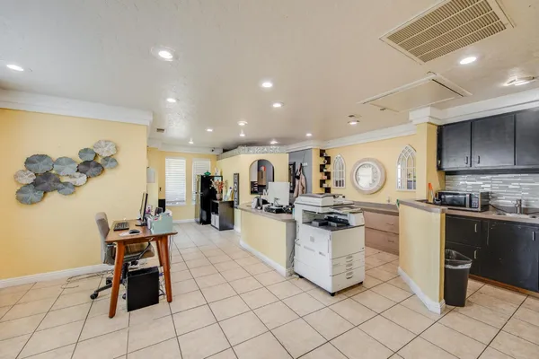 a kitchen with a stove and a refrigerator