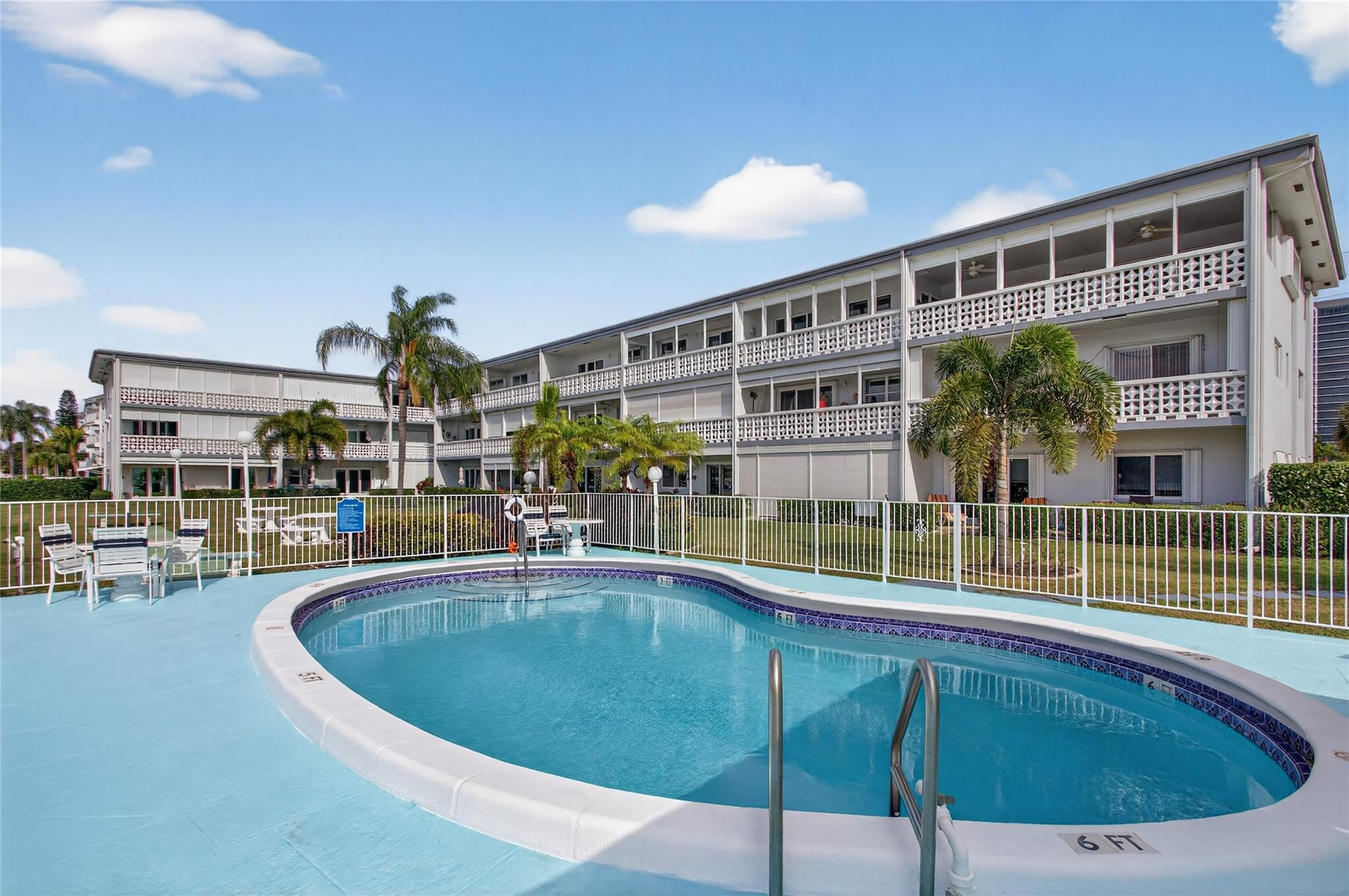 1001 North Riverside Drive, Unit 305 Pompano Beach, FL 33062 - Photo 31 of 44 a view of a swimming pool with outdoor seating