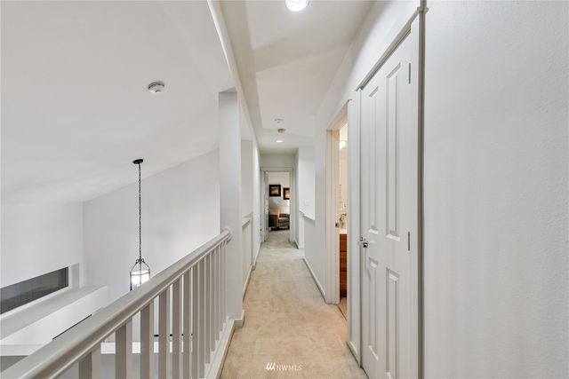 a view of a hallway view with staircase