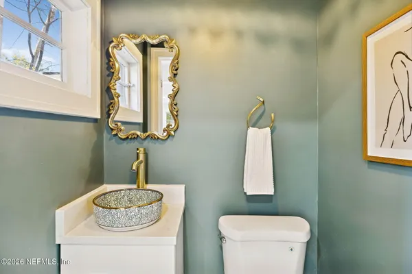 a bathroom with a toilet and a sink