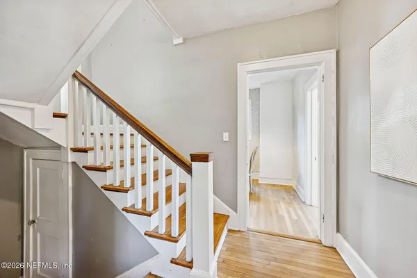 a view of entryway with wooden floor