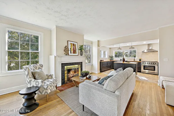 a living room with furniture and a fireplace