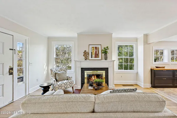 a living room with furniture and a fireplace