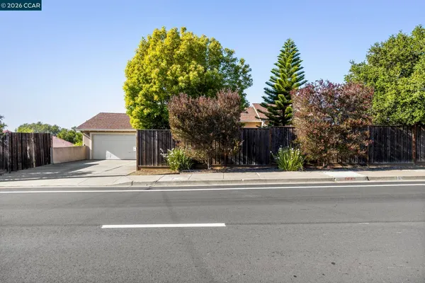 a view of a house and a yard