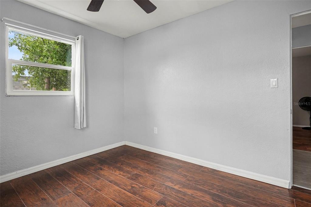 355 South Oak Avenue Frostproof, FL 33843 - Photo 29 of 35 a view of empty room with wooden floor and fan