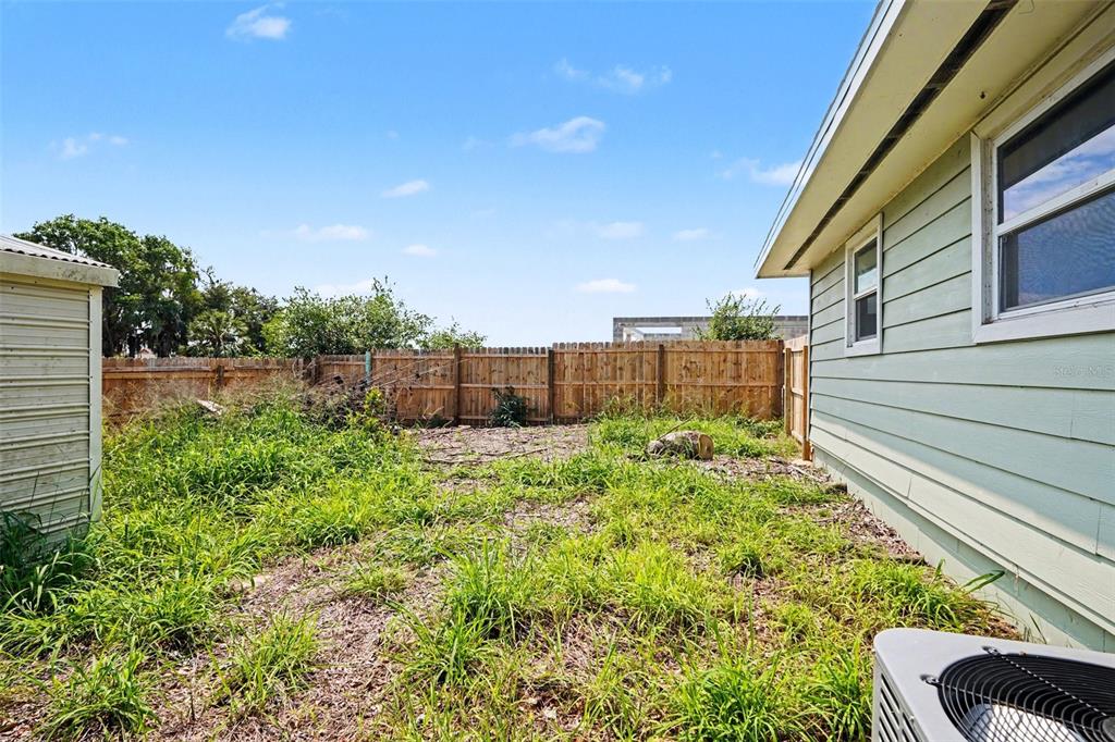 355 South Oak Avenue Frostproof, FL 33843 - Photo 32 of 35 a view of a backyard