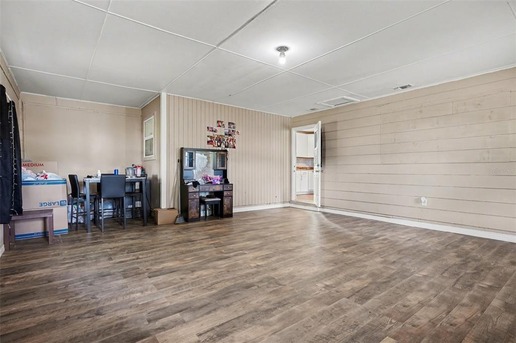 355 South Oak Avenue Frostproof, FL 33843 - Photo 6 of 35 a view of a room with wooden floor and furniture