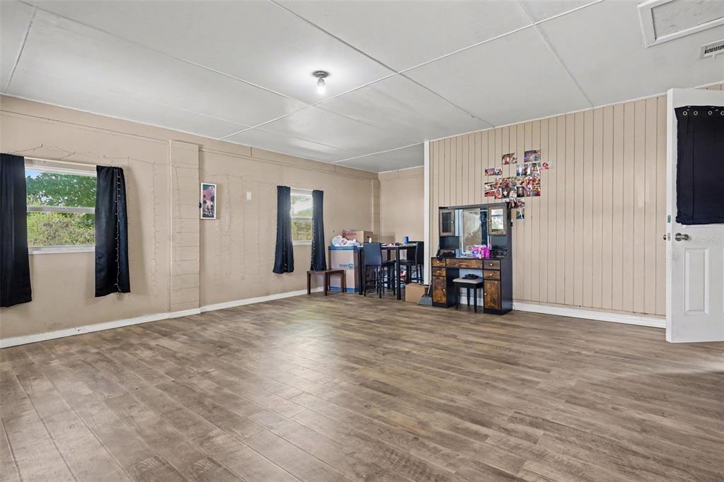 355 South Oak Avenue Frostproof, FL 33843 - Photo 7 of 35 a view of a livingroom with a flat screen tv and a large window