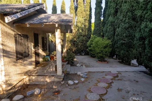 a view of a house with a tree