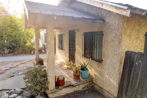 a front view of a house with trees