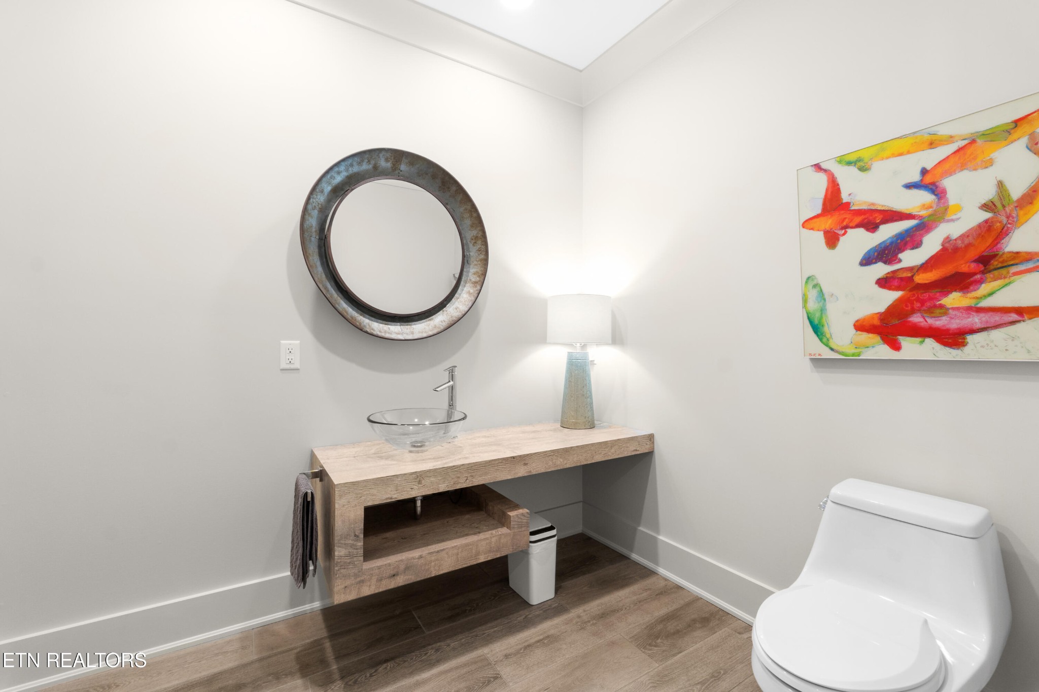 3702 Promontory Point Louisville, TN 37777 - Photo 30 of 60 a bathroom with a toilet a sink and a mirror