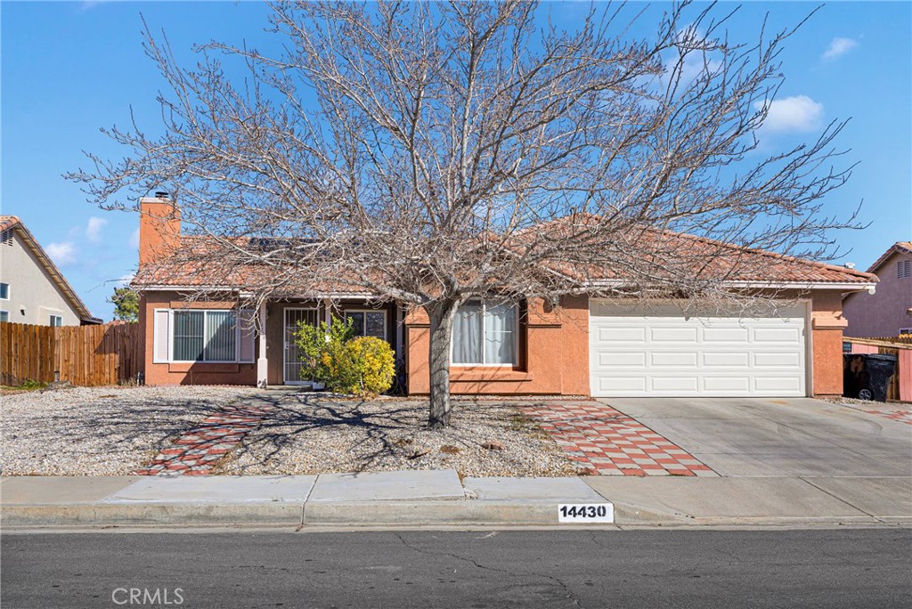 14430 Ponderosa Ranch Road Victorville, CA 92392 - Photo 1 of 1 a front view of a house with a yard