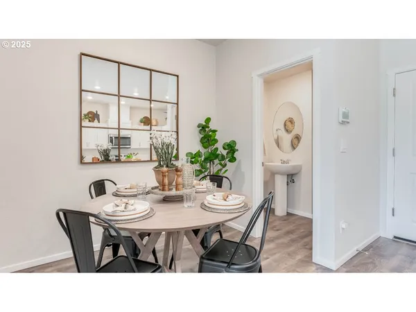 a dining room with furniture and window