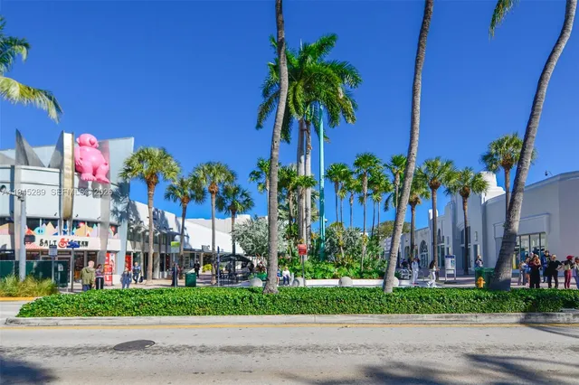 a front view of multiple houses with yard