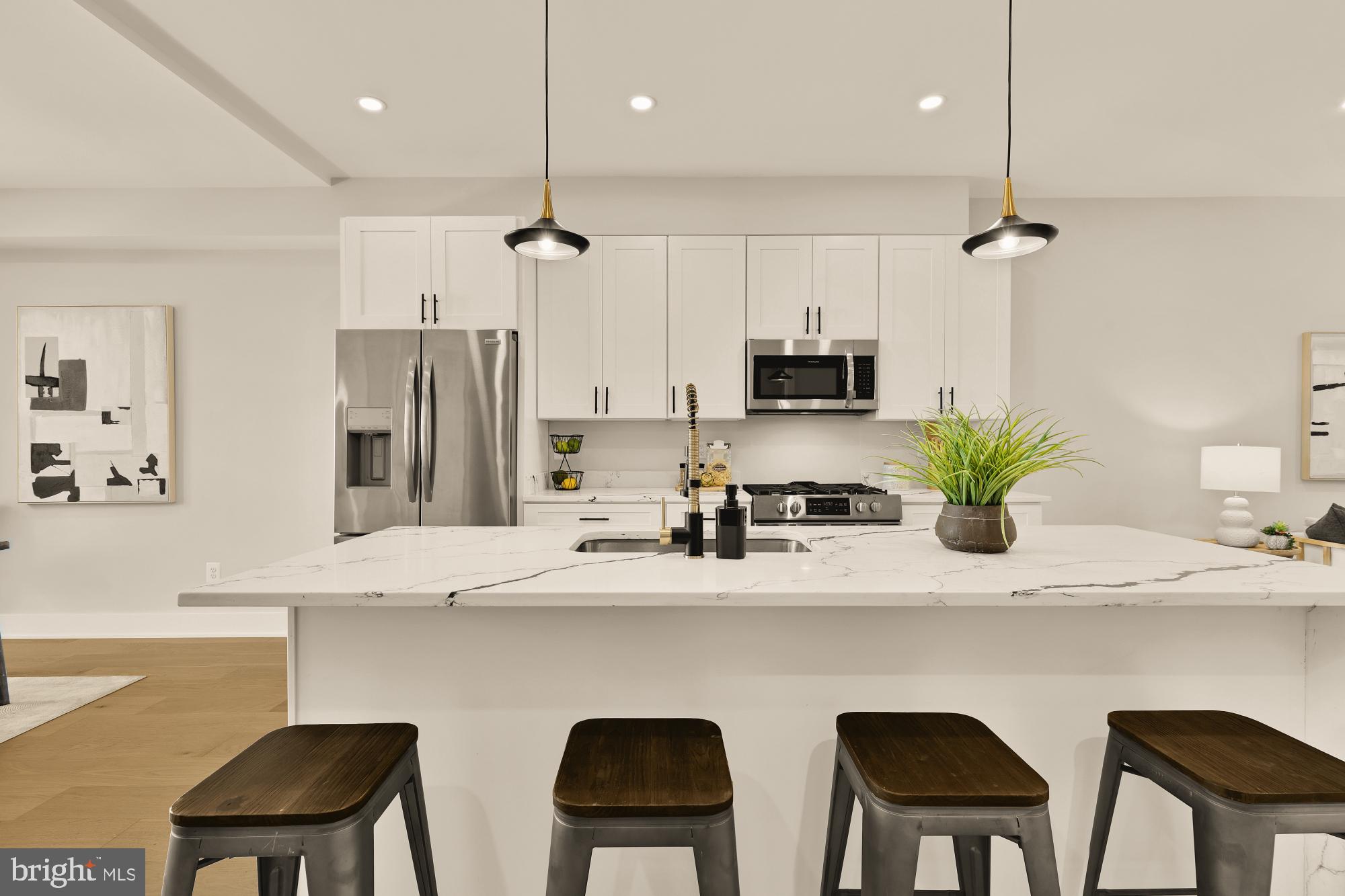 815 Marietta Place Northwest Washington, DC 20011 - Photo 11 of 44 a kitchen with a table chairs refrigerator and microwave