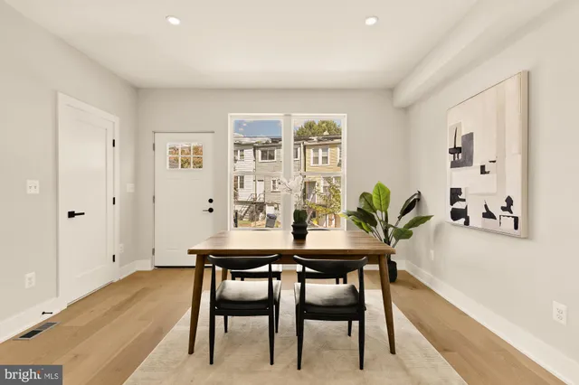 a view of a dining room with furniture and window