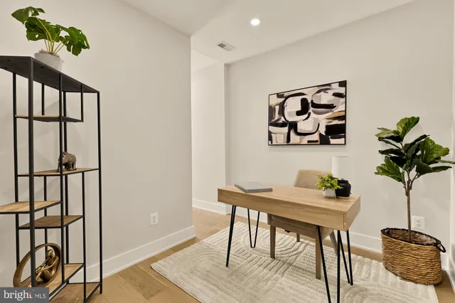 a view of a workspace with furniture