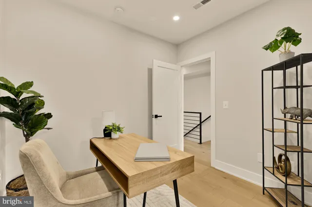 a workspace with furniture and window