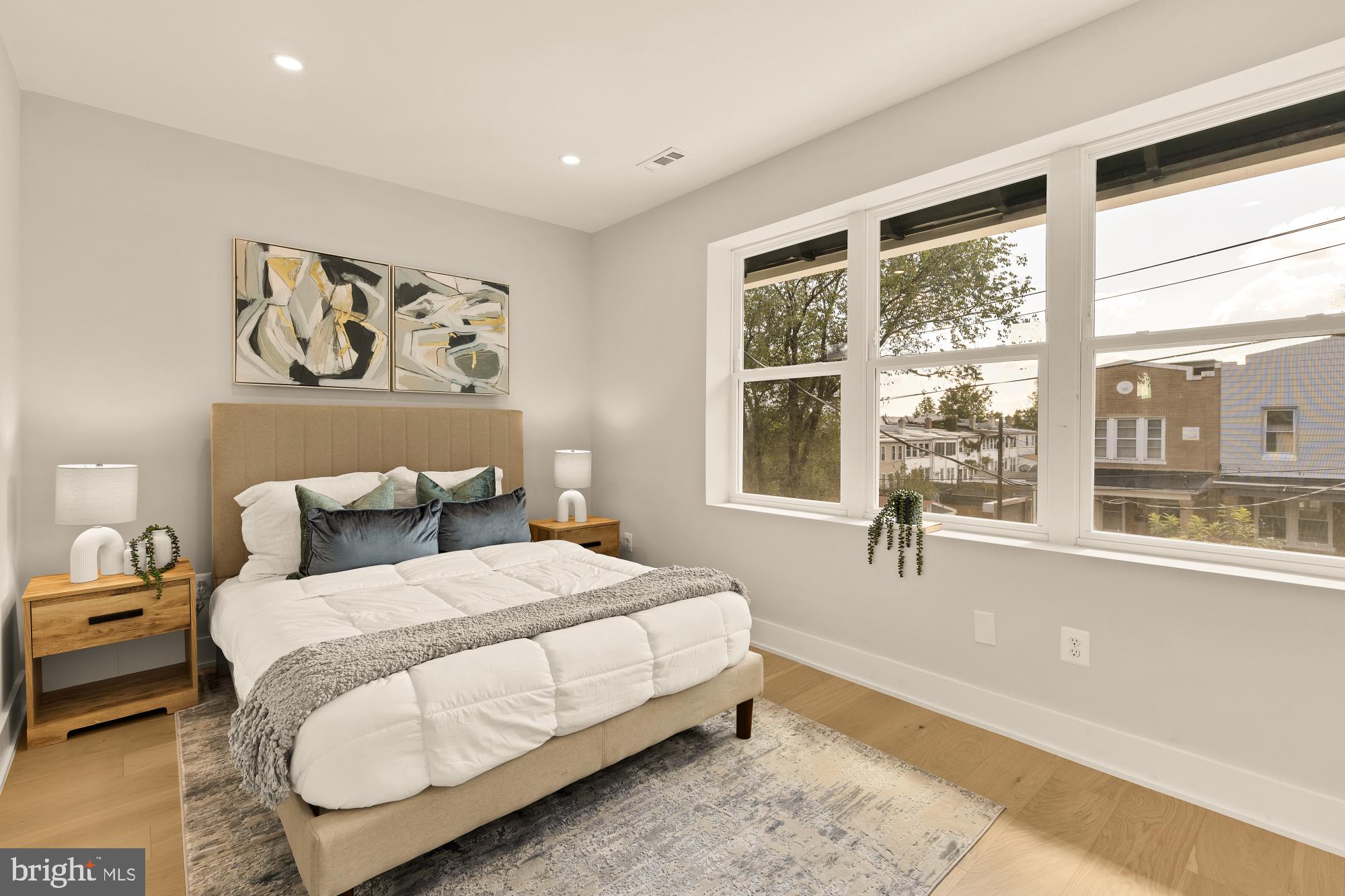 815 Marietta Place Northwest Washington, DC 20011 - Photo 31 of 44 a bedroom with a bed and glass window